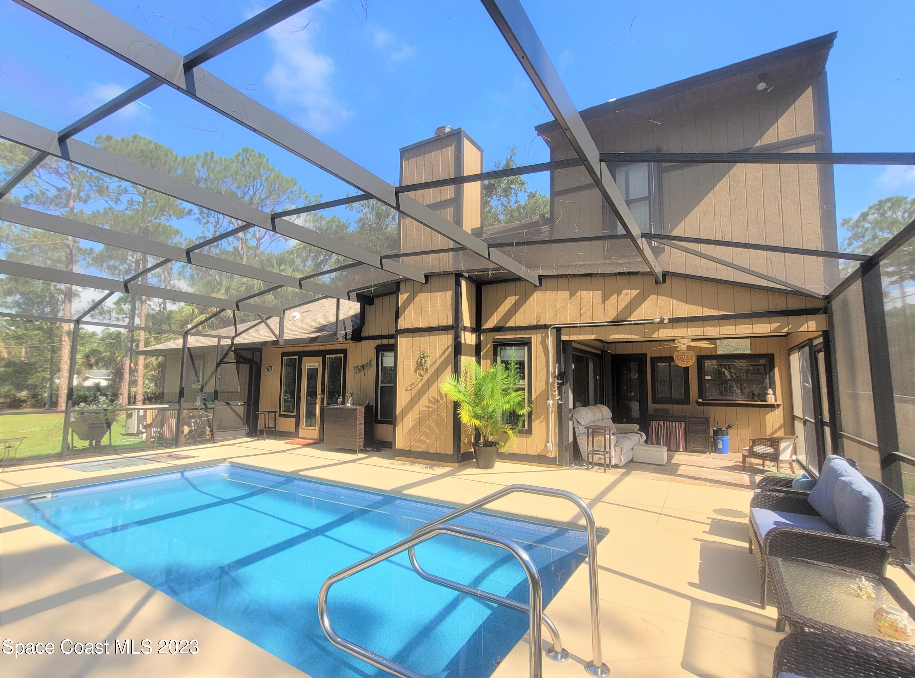 3805 Corey Road Malabar, FL 32950 - Photo 44 of 72 a view of a patio with swimming pool