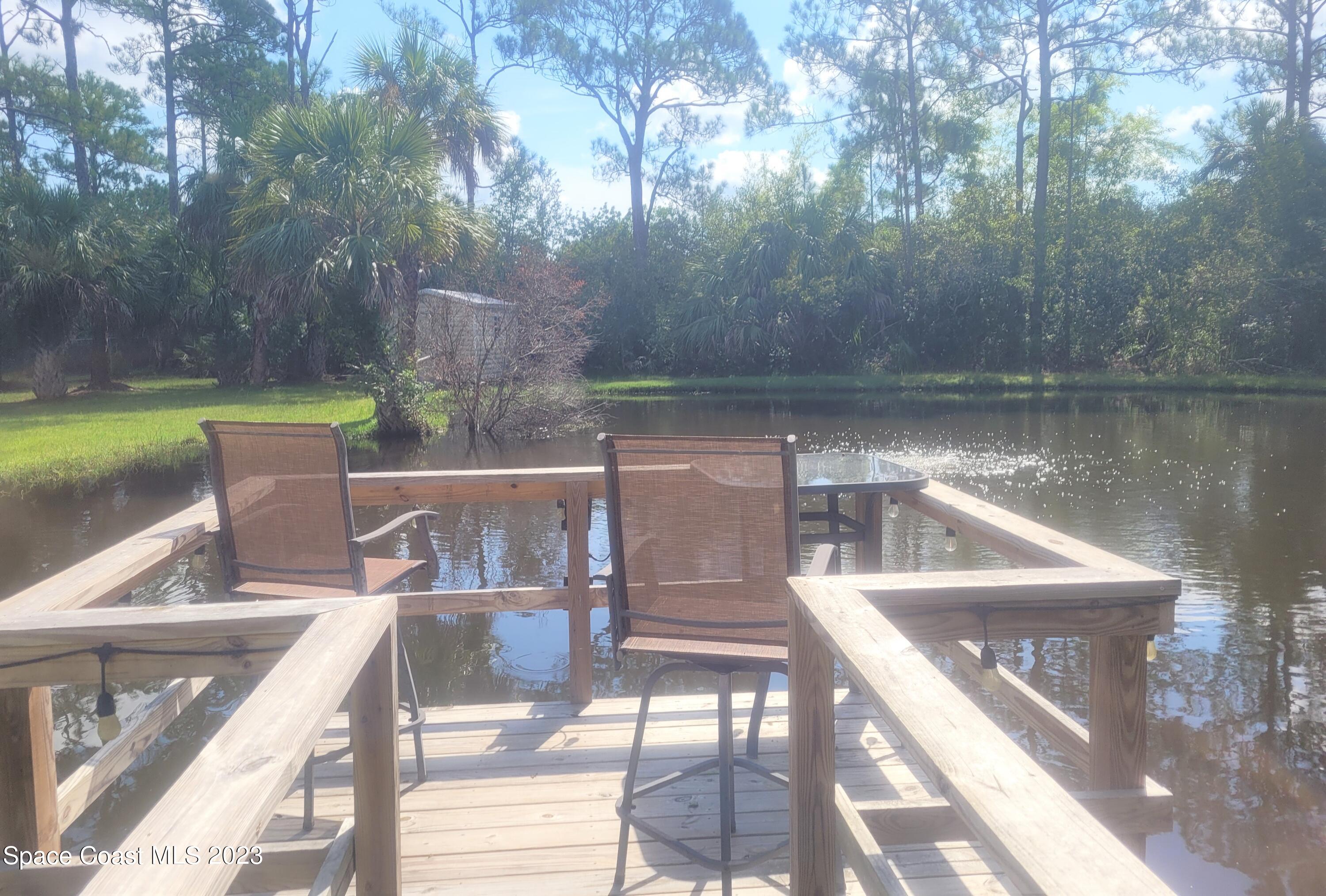 3805 Corey Road Malabar, FL 32950 - Photo 60 of 72 a view of a lake from a balcony