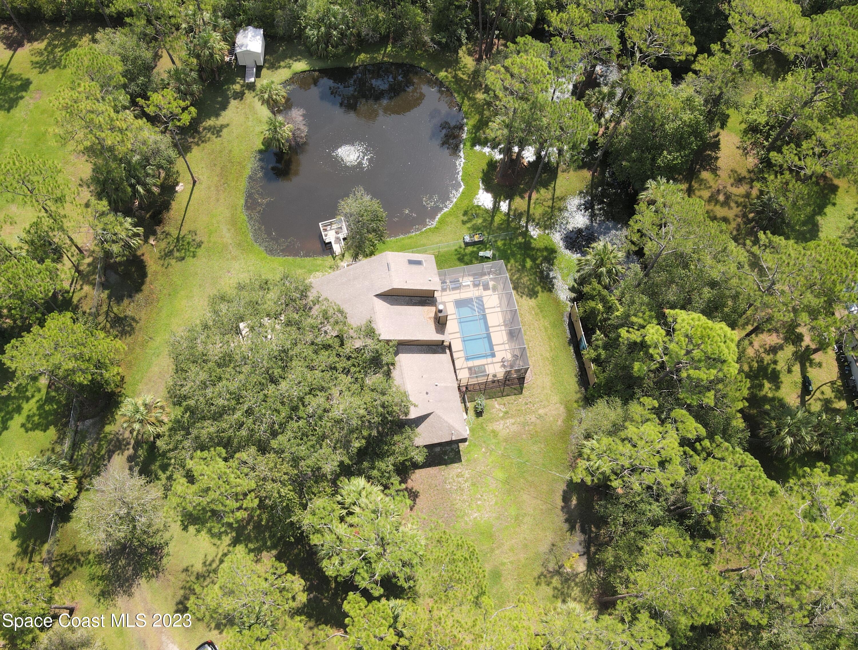 3805 Corey Road Malabar, FL 32950 - Photo 70 of 72 an aerial view of a house with a yard