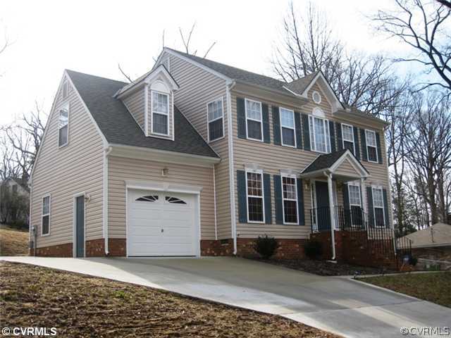 8408 Atlee Road Mechanicsville, VA 23116 - Photo 1 of 10 a front view of a house with a yard
