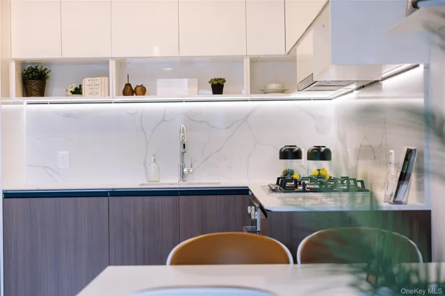 a large bed sitting in a bedroom next to a bathroom