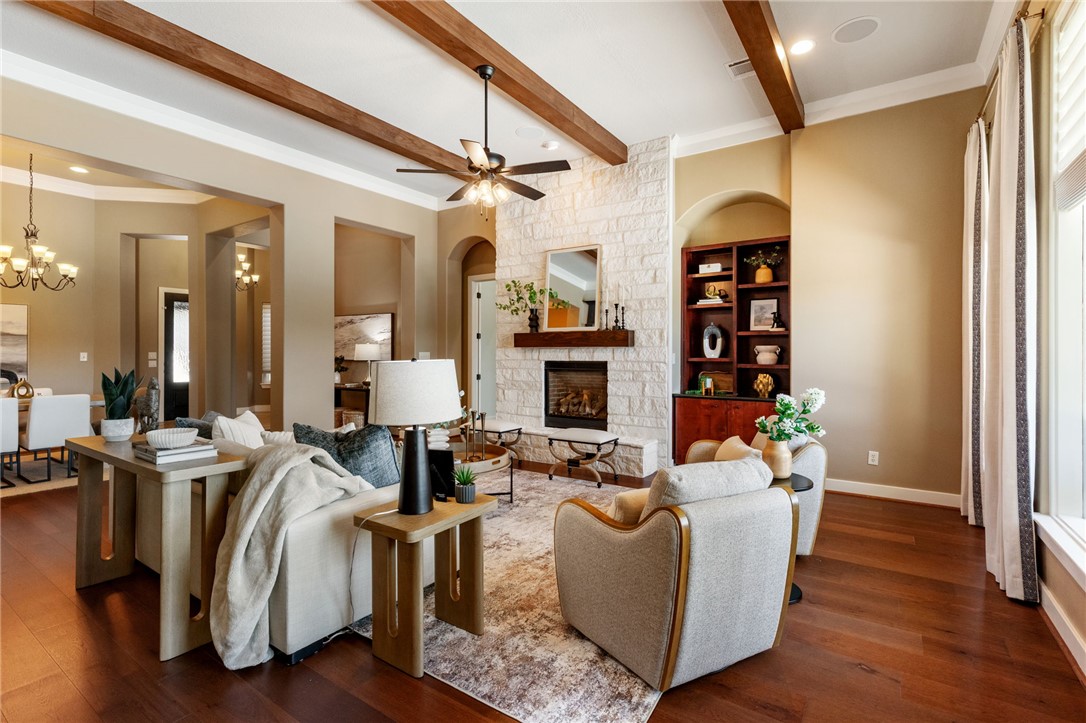 2833 Persimmon Ridge Court Bryan, TX 77807 - Photo 24 of 50 a living room with fireplace furniture and a wooden floor