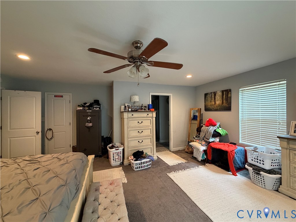 1124 Myrtle Street Suffolk, VA 23434 - Photo 10 of 15 Spacious room featuring a ceiling fan with light f