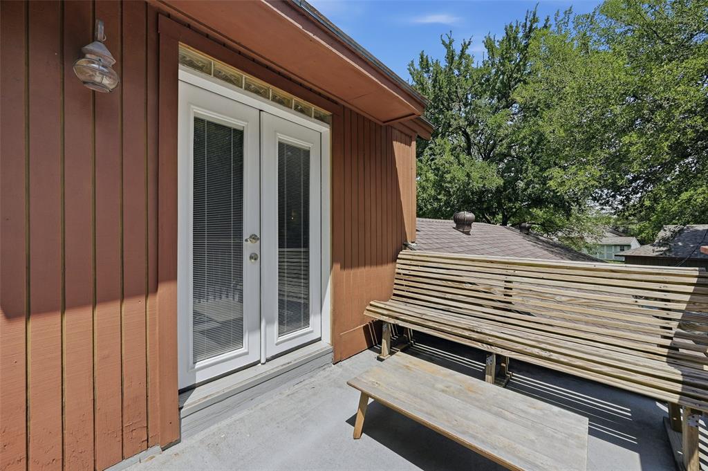 522 High Country Road Sherman, TX 75092 - Photo 26 of 38 a view of a patio with a bench and wooden roof
