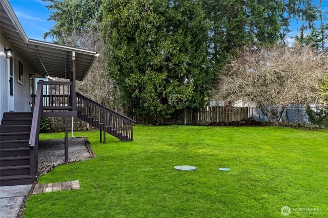 a backyard of a house with lots of green space