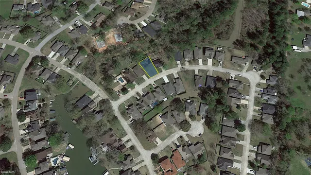 an aerial view of a residential apartment building with a yard