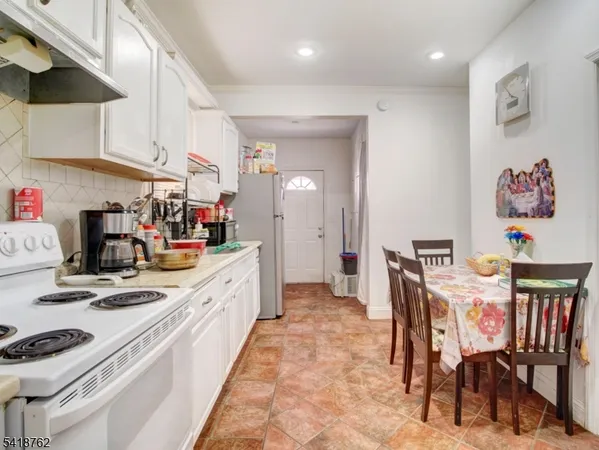 a kitchen with stainless steel appliances granite countertop a sink and cabinets