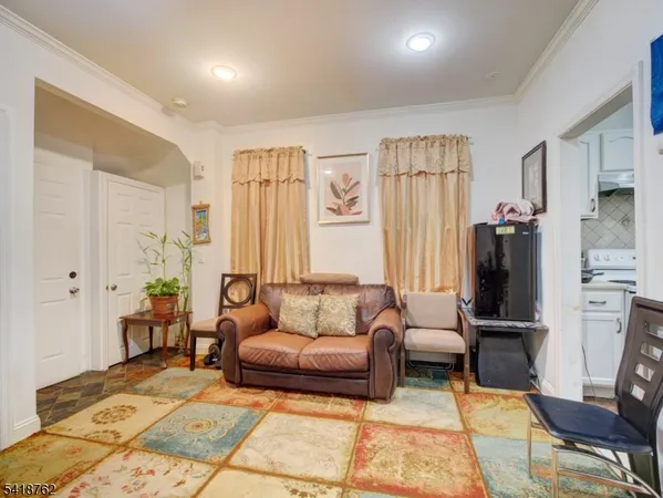 a living room with furniture and a rug