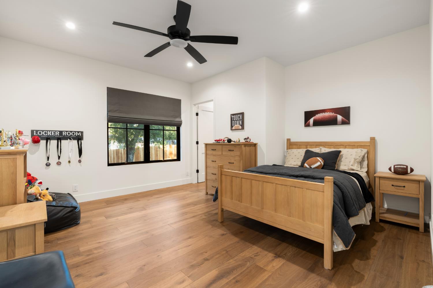 7697 Horseshoe Bar Road Loomis, CA 95650 - Photo 30 of 76 a spacious bedroom with a bed and a couch