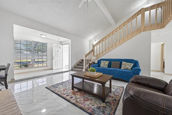 a living room with furniture and a table