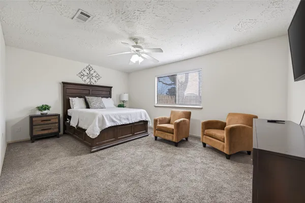 a bed room with bed and a couch