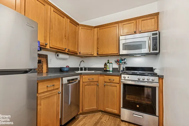 a view of a livingroom with furniture and wooden floor