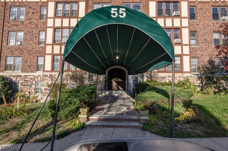 55 Randolph Place, Unit 301 South Orange, NJ 07079 - Photo 2 of 23 a front view of a house with garden
