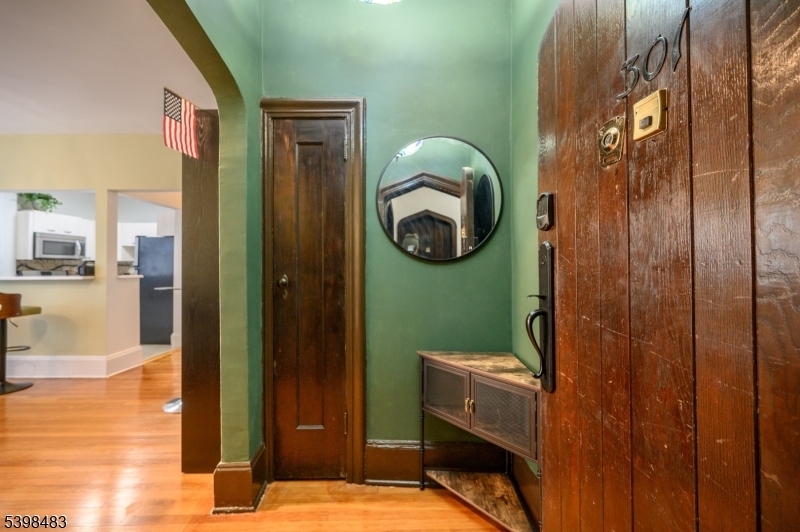 55 Randolph Place, Unit 301 South Orange, NJ 07079 - Photo 4 of 23 a bathroom with a sink and mirror
