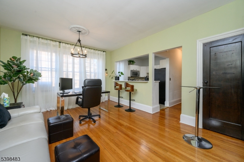 55 Randolph Place, Unit 301 South Orange, NJ 07079 - Photo 6 of 23 a workspace with furniture window and wooden floor