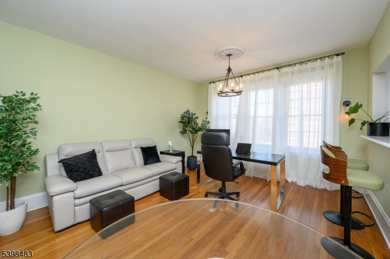 55 Randolph Place, Unit 301 South Orange, NJ 07079 - Photo 7 of 23 a living room with furniture and a window