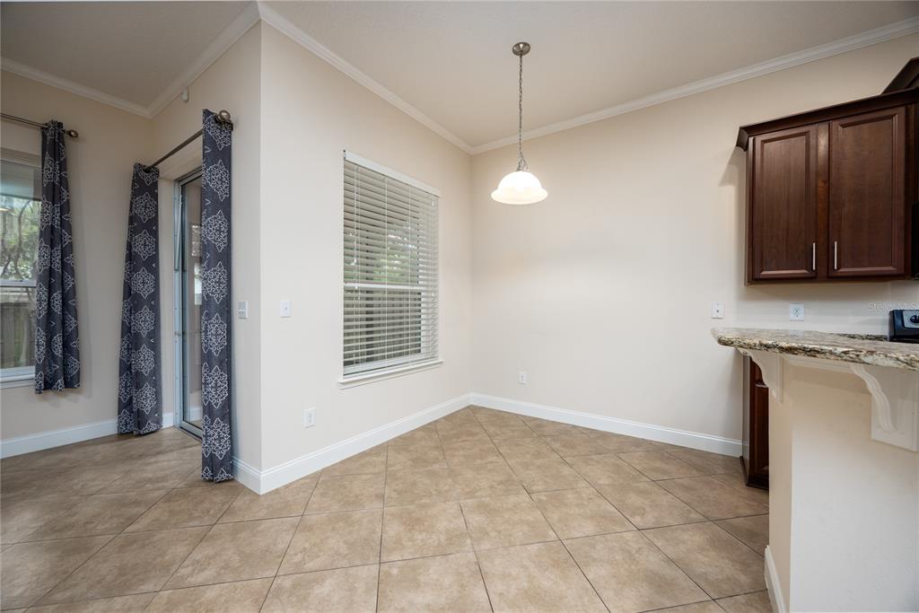 8216 Northwest 54th Street Gainesville, FL 32653 - Photo 32 of 58 a view of an empty room with a fireplace and a window
