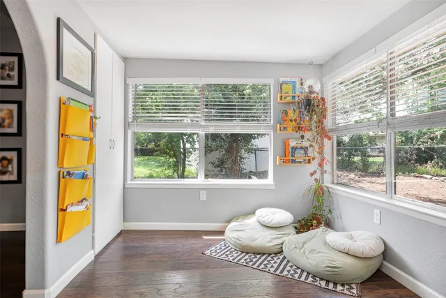 a bathroom with a sink and a large window