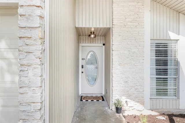 a bathroom with a granite countertop shower and a sink