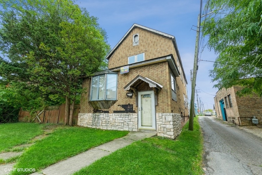 2347 Walnut Street Blue Island, IL 60406 - Photo 1 of 10 a front view of a house with a garden