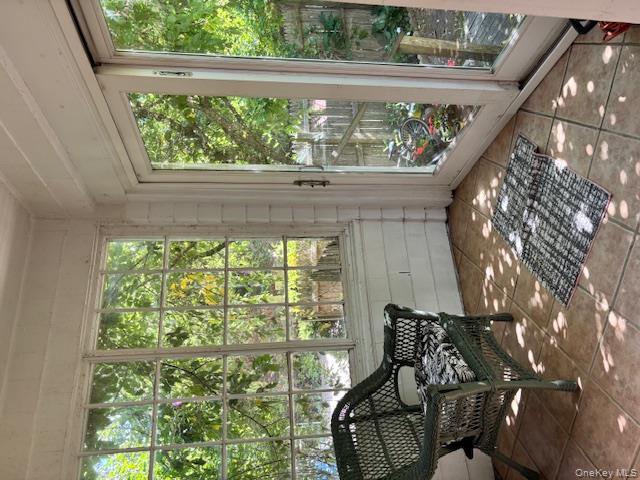 761 East Main Street Riverhead, NY 11901 - Photo 11 of 22 a living room with furniture and a floor to ceiling window