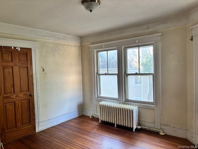 761 East Main Street Riverhead, NY 11901 - Photo 15 of 22 an empty room with wooden floor and windows