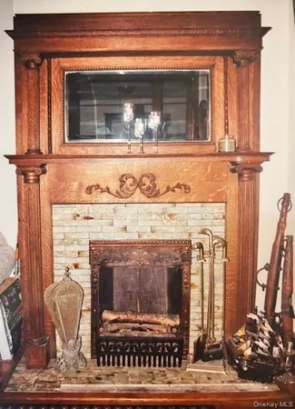 a view of a fireplace with a mirror