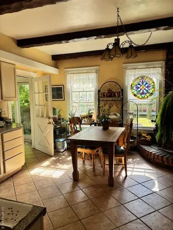 a living room with furniture a rug and a window
