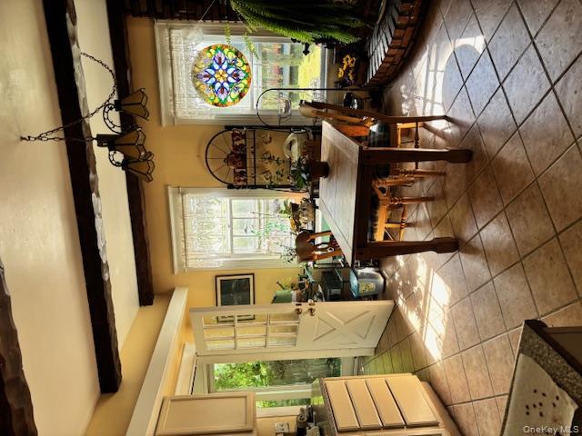761 East Main Street Riverhead, NY 11901 - Photo 8 of 22 a living room with furniture a rug and a window