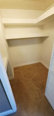 a bathroom with a granite countertop toilet sink and shower