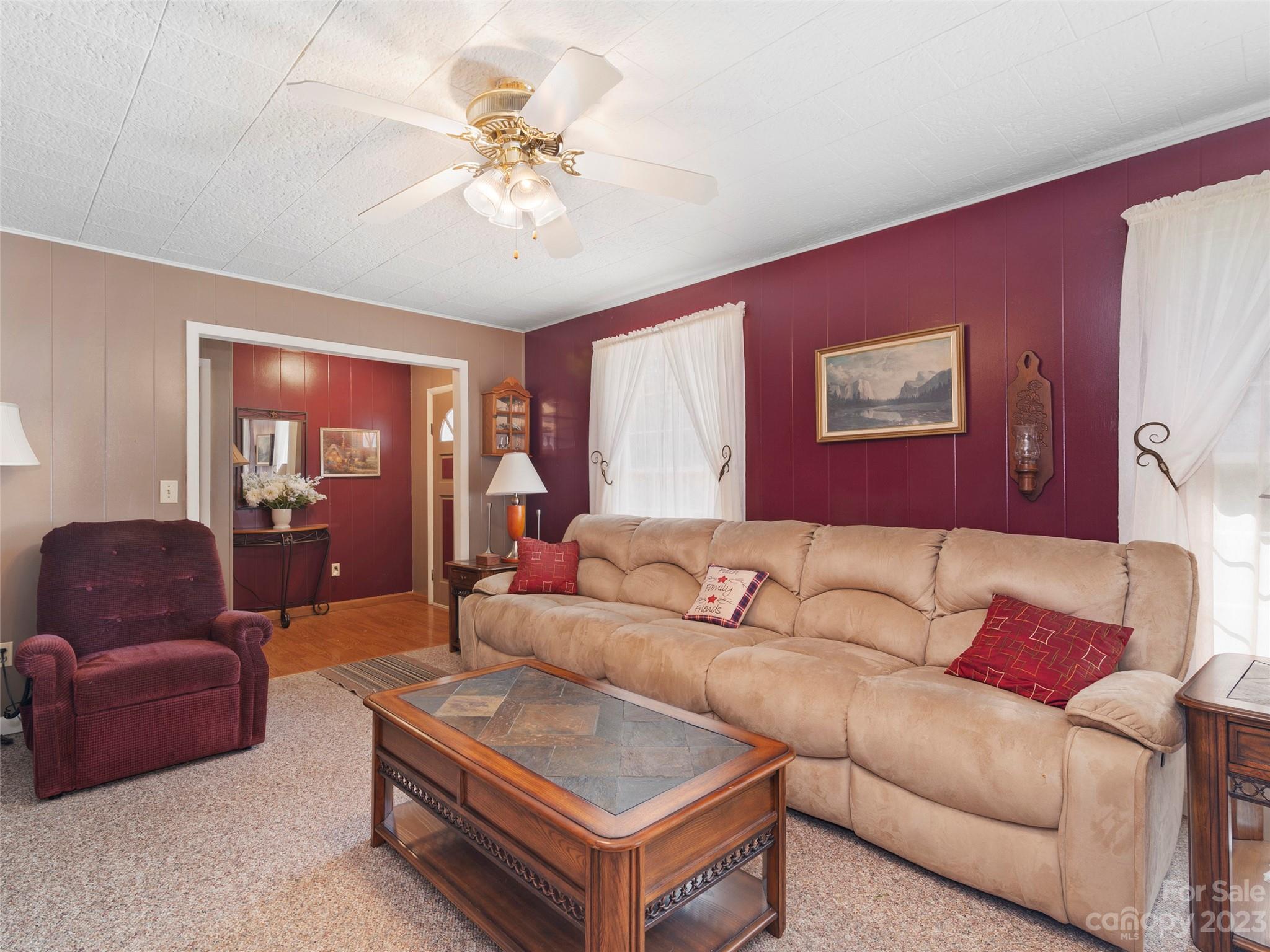 450 Chambers Road Waynesville, NC 28786 - Photo 11 of 28 a living room with furniture and a ceiling fan