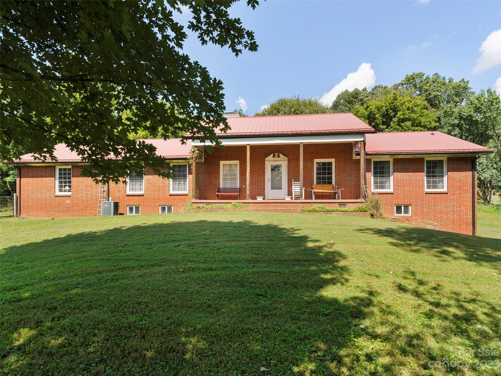 450 Chambers Road Waynesville, NC 28786 - Photo 24 of 28 a front view of a house with a yard