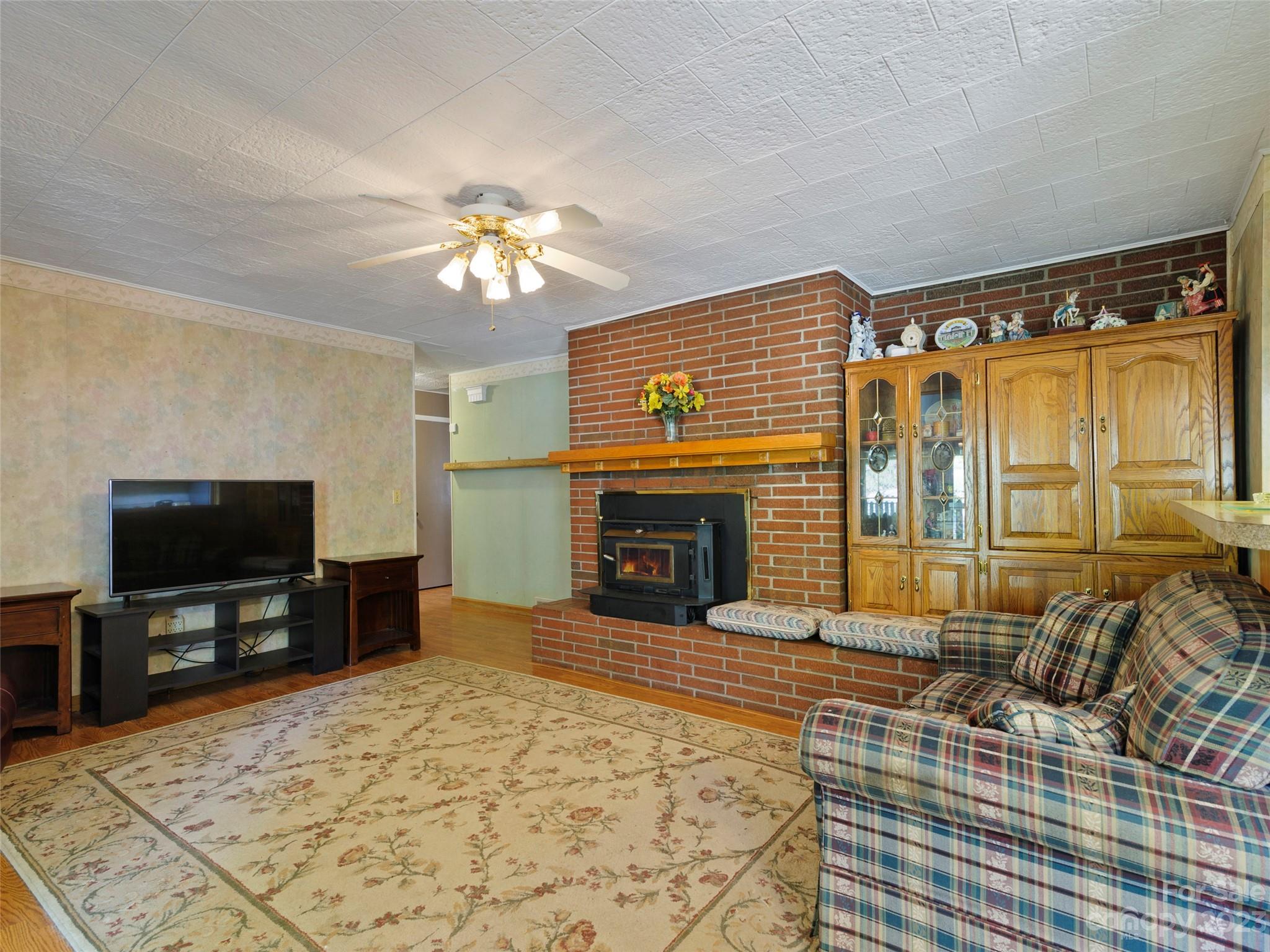 450 Chambers Road Waynesville, NC 28786 - Photo 6 of 28 a living room with furniture and a flat screen tv