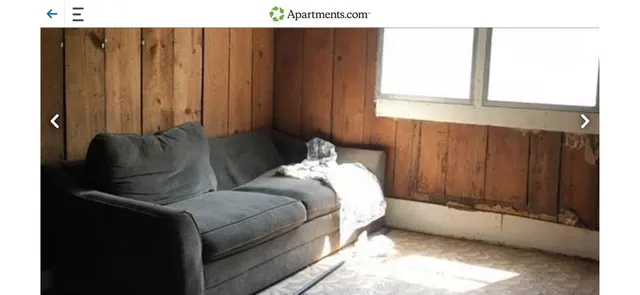 a bedroom with bed and window