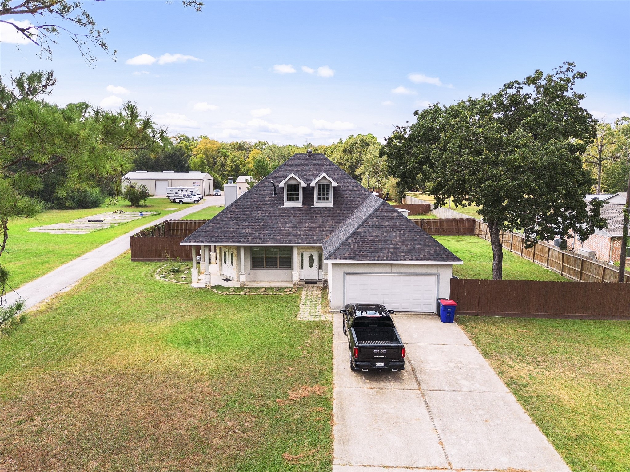 22831 Fritz Lane Spring, TX 77389 - Photo 5 of 50 Charming 3/2/2 residence located at the front of the property. This home offers modern amenities, fireplace, fully fenced yard, large laundry and garage with lots of storage space. New roof in 2025.