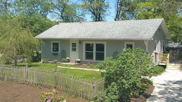 1 Pokesit Road Pocasset, MA 02559 - Photo 1 of 16 a house with a garden view
