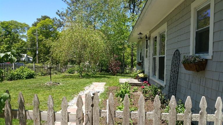 1 Pokesit Road Pocasset, MA 02559 - Photo 2 of 16 a yard with lots of green space