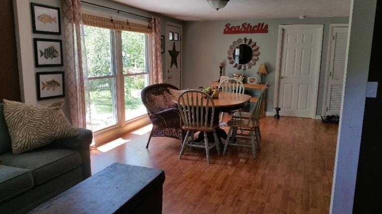 1 Pokesit Road Pocasset, MA 02559 - Photo 4 of 16 a dining room with furniture and wooden floor
