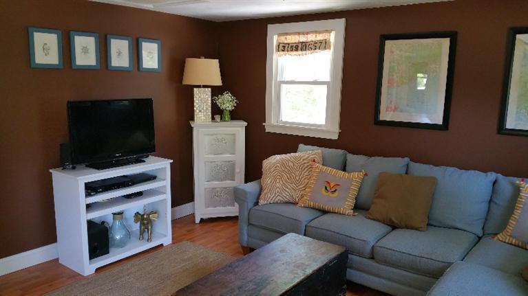 1 Pokesit Road Pocasset, MA 02559 - Photo 6 of 16 a living room with furniture and a flat screen tv