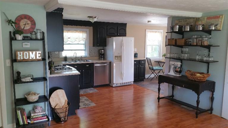 1 Pokesit Road Pocasset, MA 02559 - Photo 7 of 16 a kitchen with stainless steel appliances granite countertop a refrigerator and a stove top oven