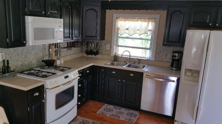 1 Pokesit Road Pocasset, MA 02559 - Photo 8 of 16 a kitchen with a stove and a refrigerator