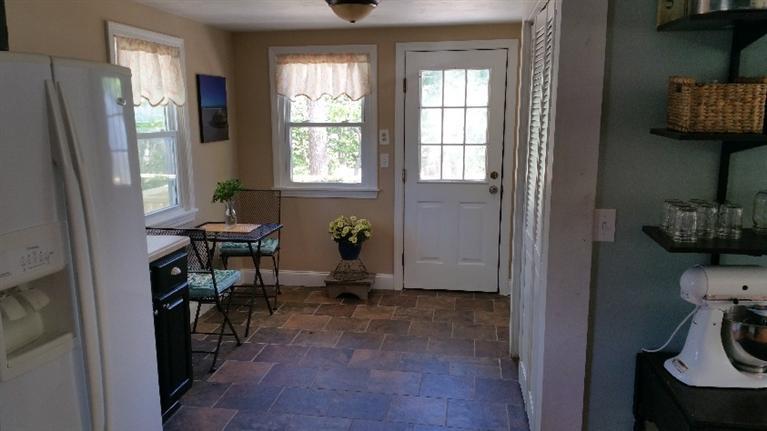 1 Pokesit Road Pocasset, MA 02559 - Photo 9 of 16 a view of a room that has a bed and a window in it