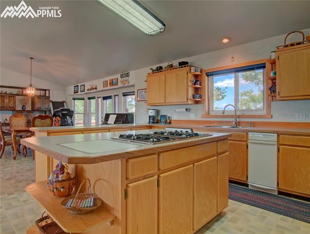 6890 Rio Road Peyton, CO 80831 - Photo 9 of 26 Gas cook-top and trash compactor