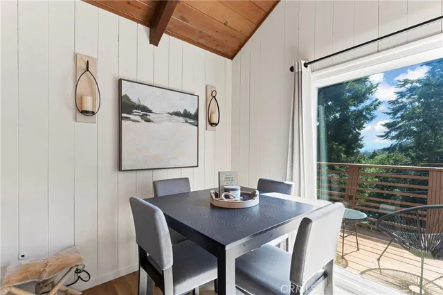 a kitchen with stainless steel appliances white cabinets and a stove top oven