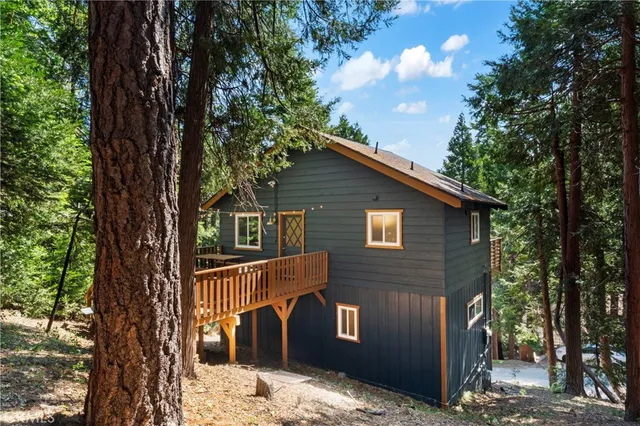 a bedroom with two beds and a dresser