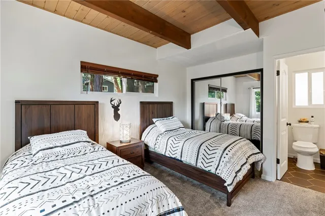 a bedroom with a bed and a mirror