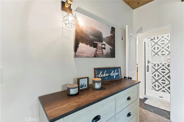 a bathroom with a granite countertop sink mirror toilet and bathtub