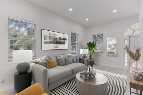 a living room with furniture and a large window