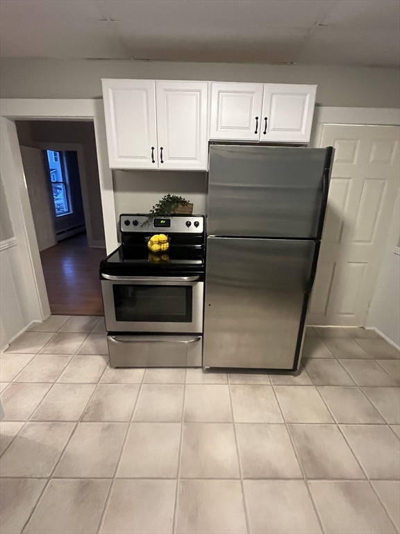 349 Main Street, Unit 2 Douglas, MA 01516 - Photo 2 of 11 a kitchen with appliances and cabinets
