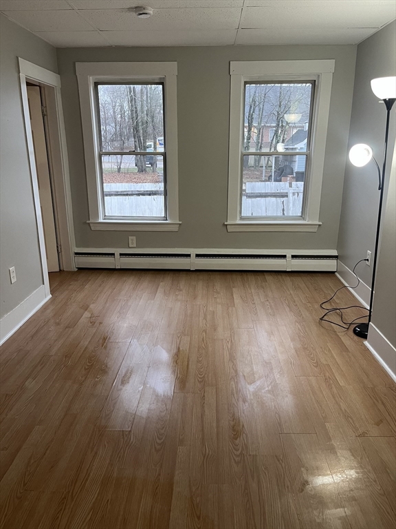 349 Main Street, Unit 2 Douglas, MA 01516 - Photo 7 of 11 a view of a room with wooden floor and window